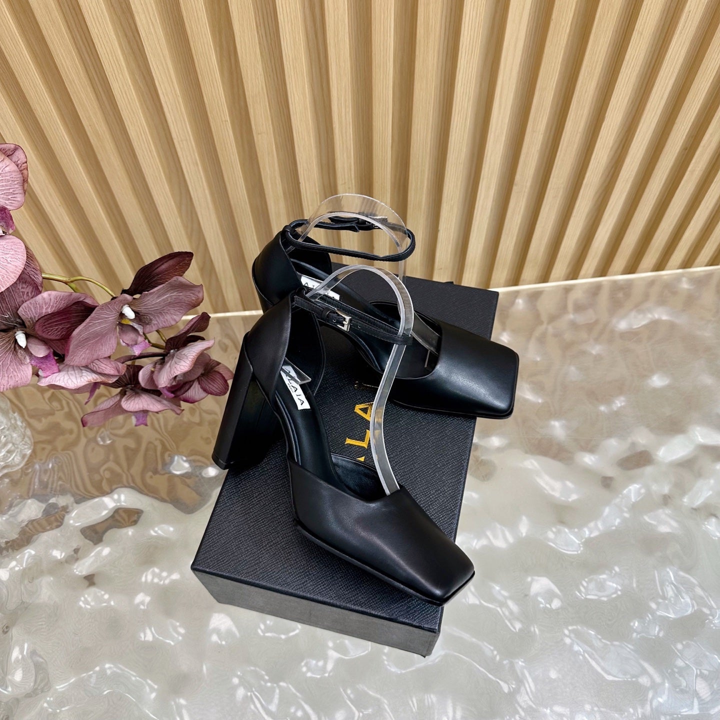 ALAÏA Minimalist Leather Ankle-Strap Block-Heel Pumps