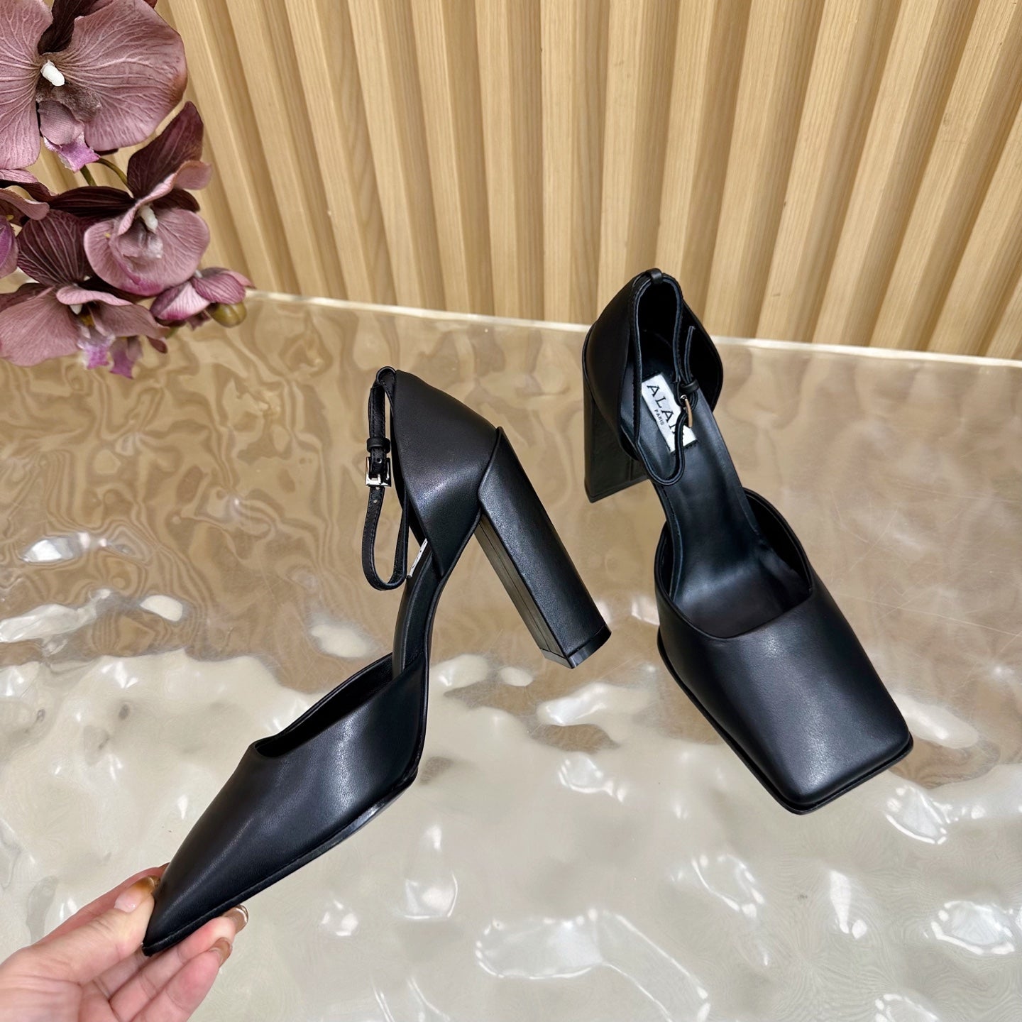 ALAÏA Minimalist Leather Ankle-Strap Block-Heel Pumps
