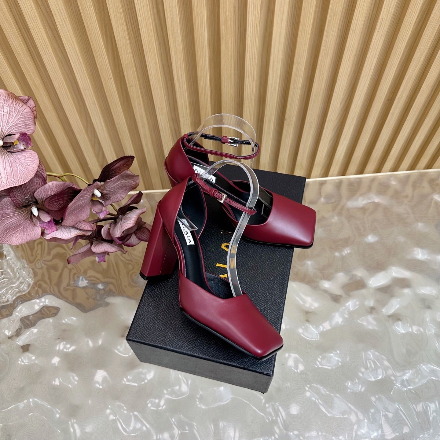 ALAÏA Minimalist Leather Ankle-Strap Block-Heel Pumps
