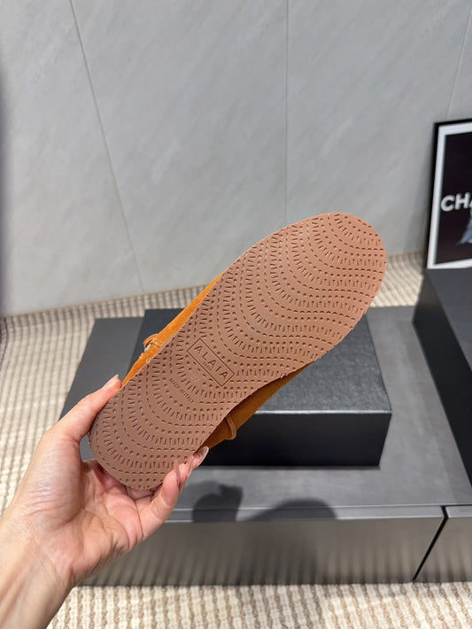 ALAÏA Shearling-Lined Suede Ankle Boots