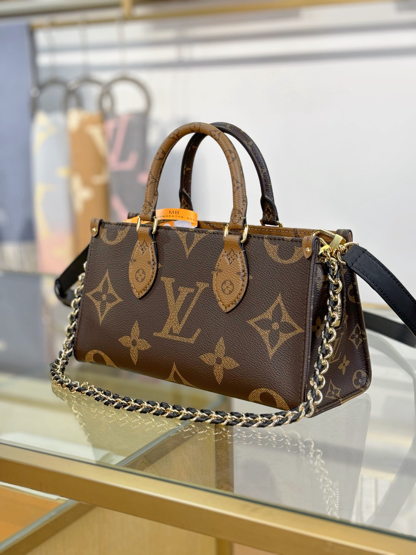 Louis Vuitton OnTheGo East West Chain Monogram Reverse Bag