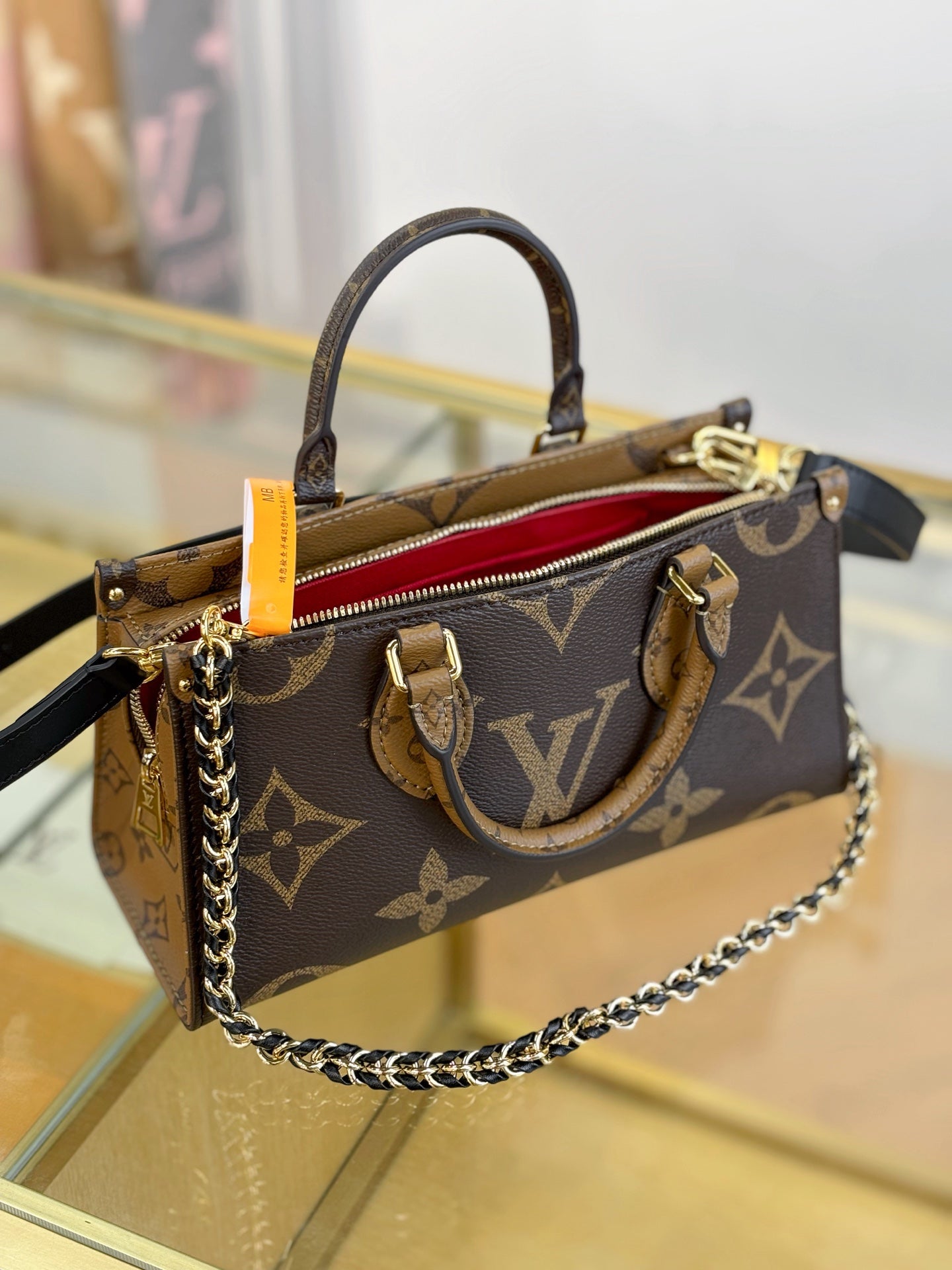 Louis Vuitton OnTheGo East West Chain Monogram Reverse Bag