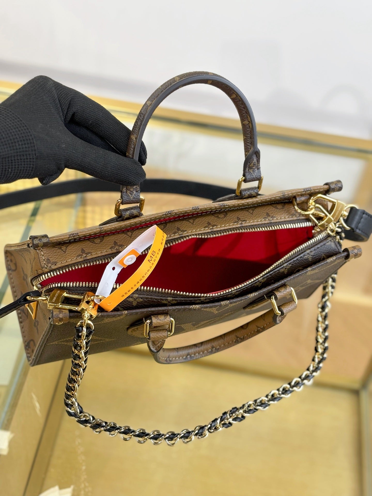 Louis Vuitton OnTheGo East West Chain Monogram Reverse Bag