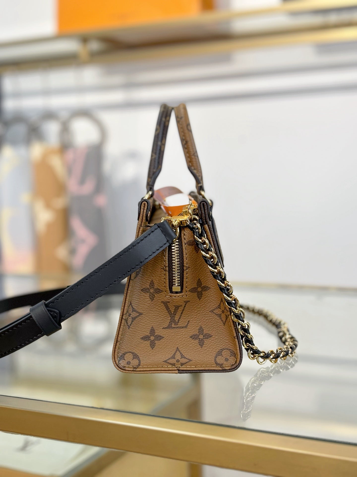 Louis Vuitton OnTheGo East West Chain Monogram Reverse Bag