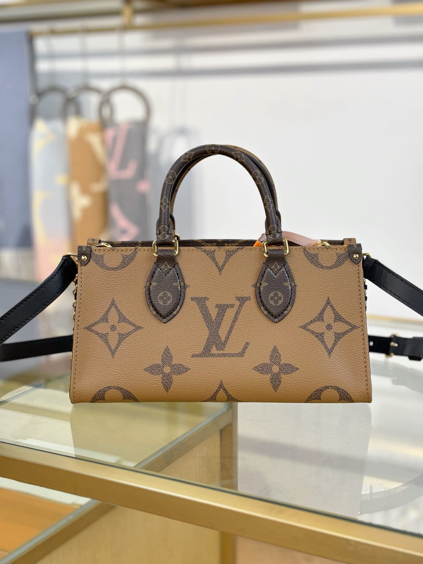 Louis Vuitton OnTheGo East West Chain Monogram Reverse Bag