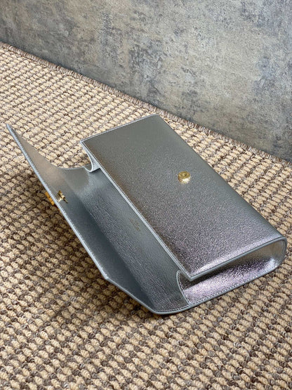 SAINT LAURENT Cassandre Metallic Logo Clutch Bag
