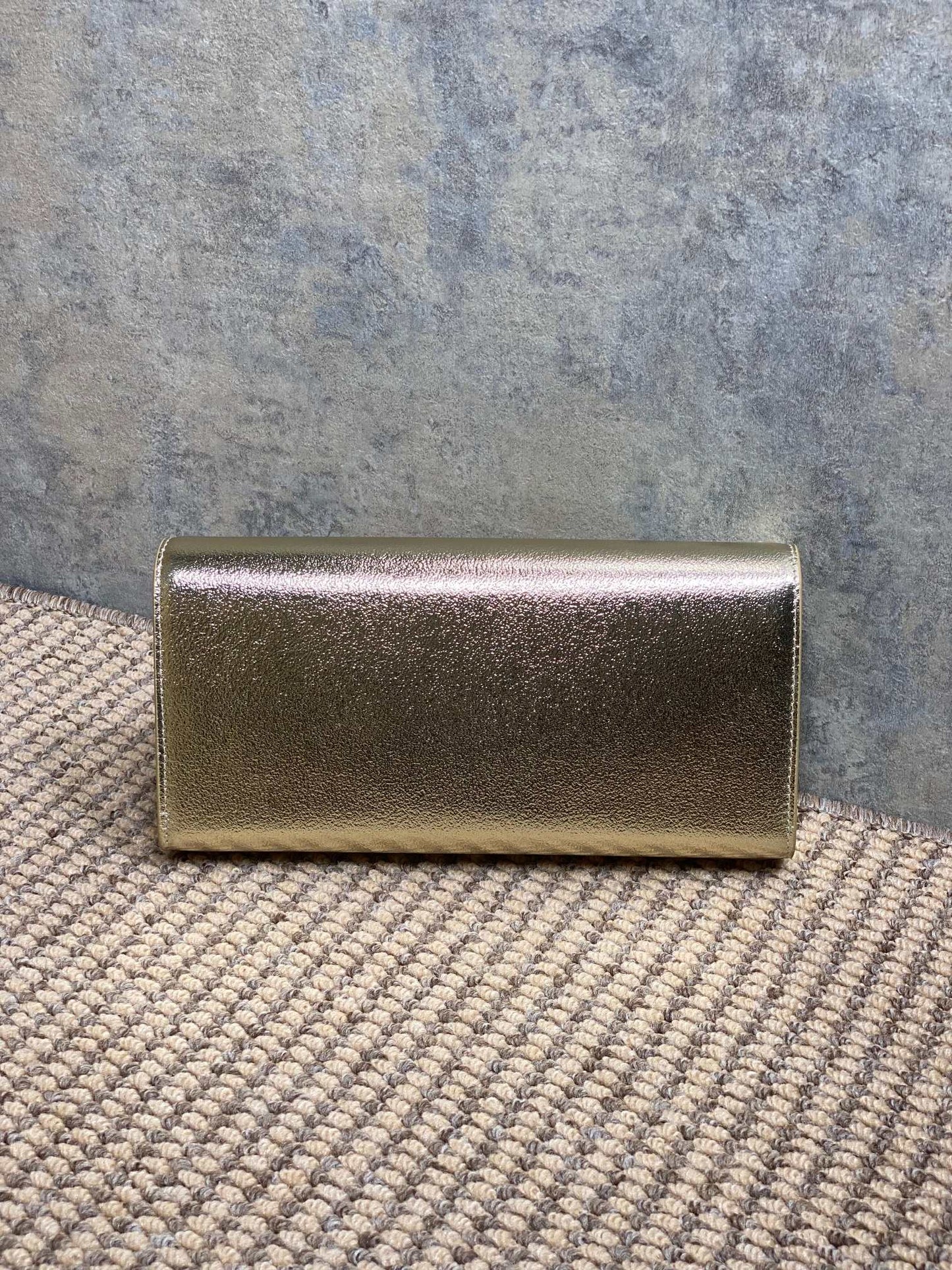 SAINT LAURENT Cassandre Metallic Logo Clutch Bag