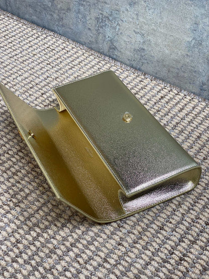 SAINT LAURENT Cassandre Metallic Logo Clutch Bag