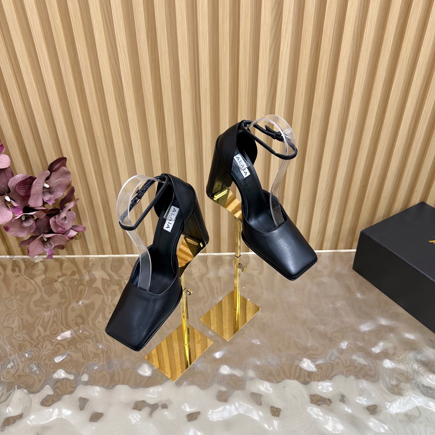 ALAÏA Minimalist Leather Ankle-Strap Block-Heel Pumps