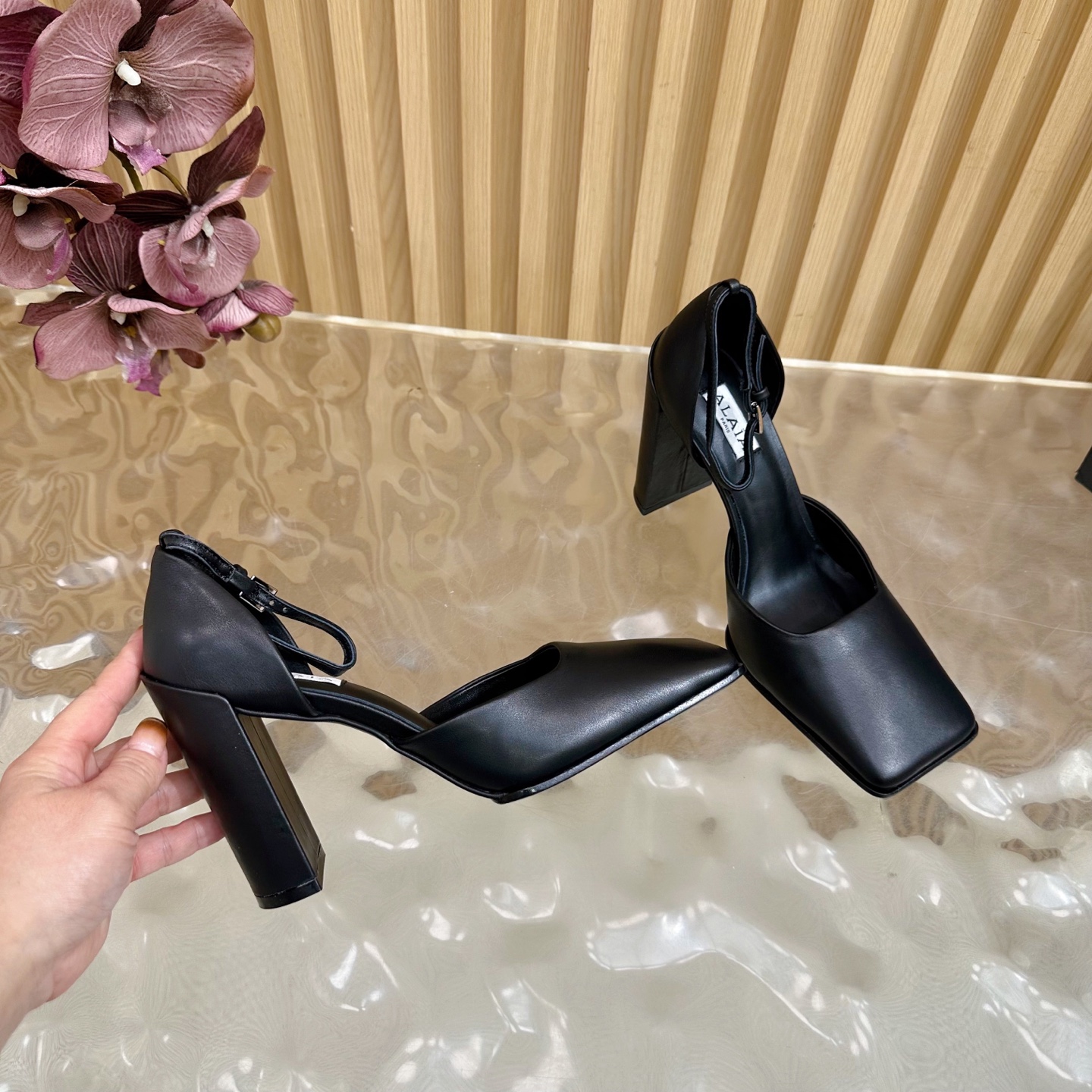 ALAÏA Minimalist Leather Ankle-Strap Block-Heel Pumps