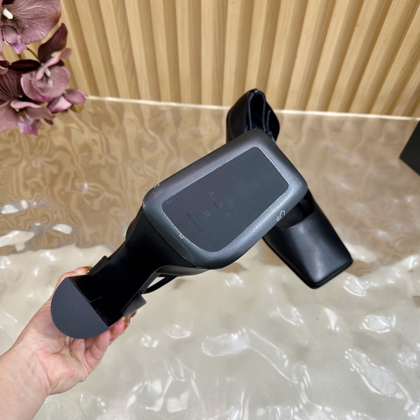 ALAÏA Minimalist Leather Ankle-Strap Block-Heel Pumps