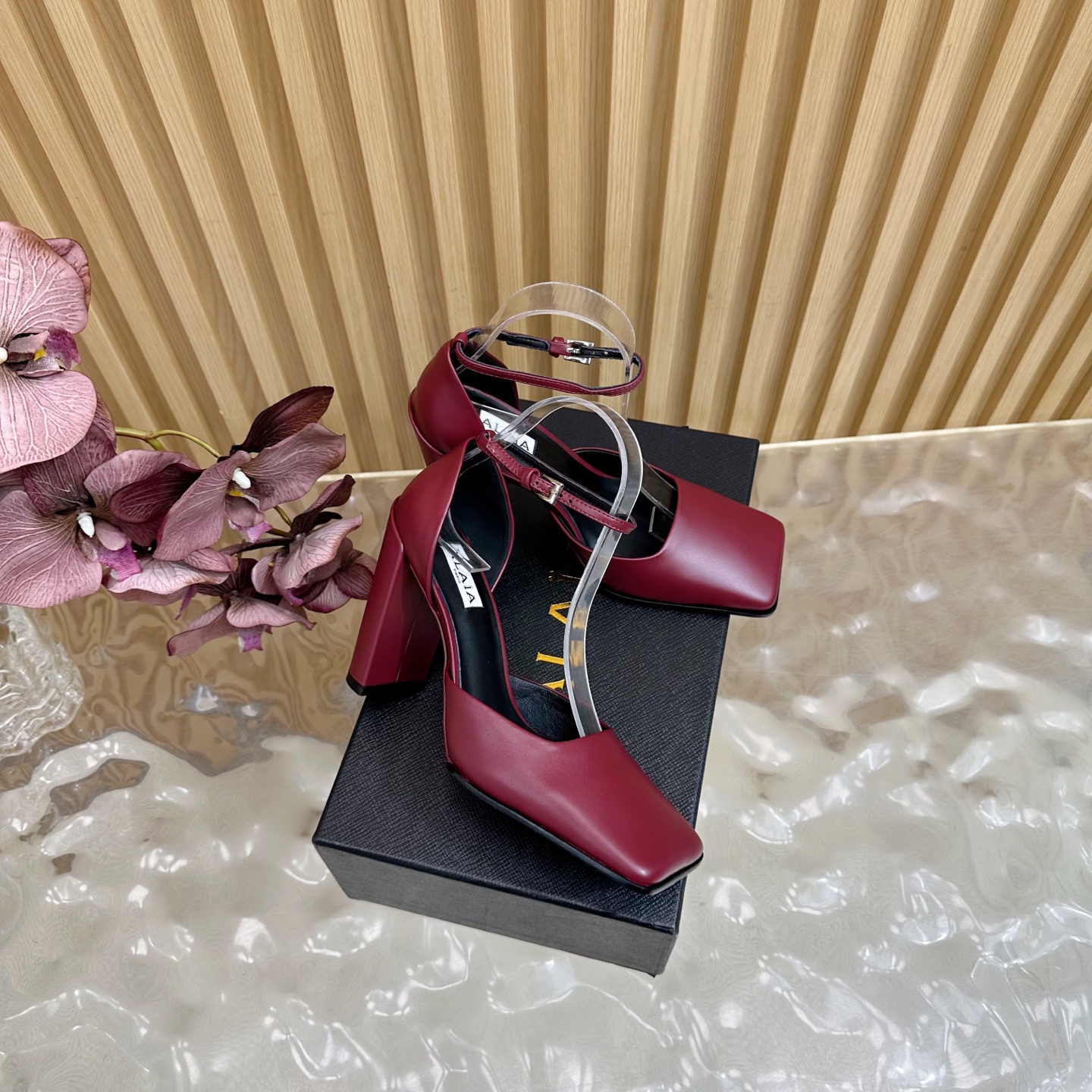 ALAÏA Minimalist Leather Ankle-Strap Block-Heel Pumps