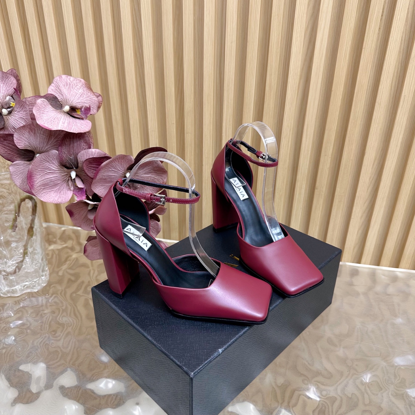 ALAÏA Minimalist Leather Ankle-Strap Block-Heel Pumps