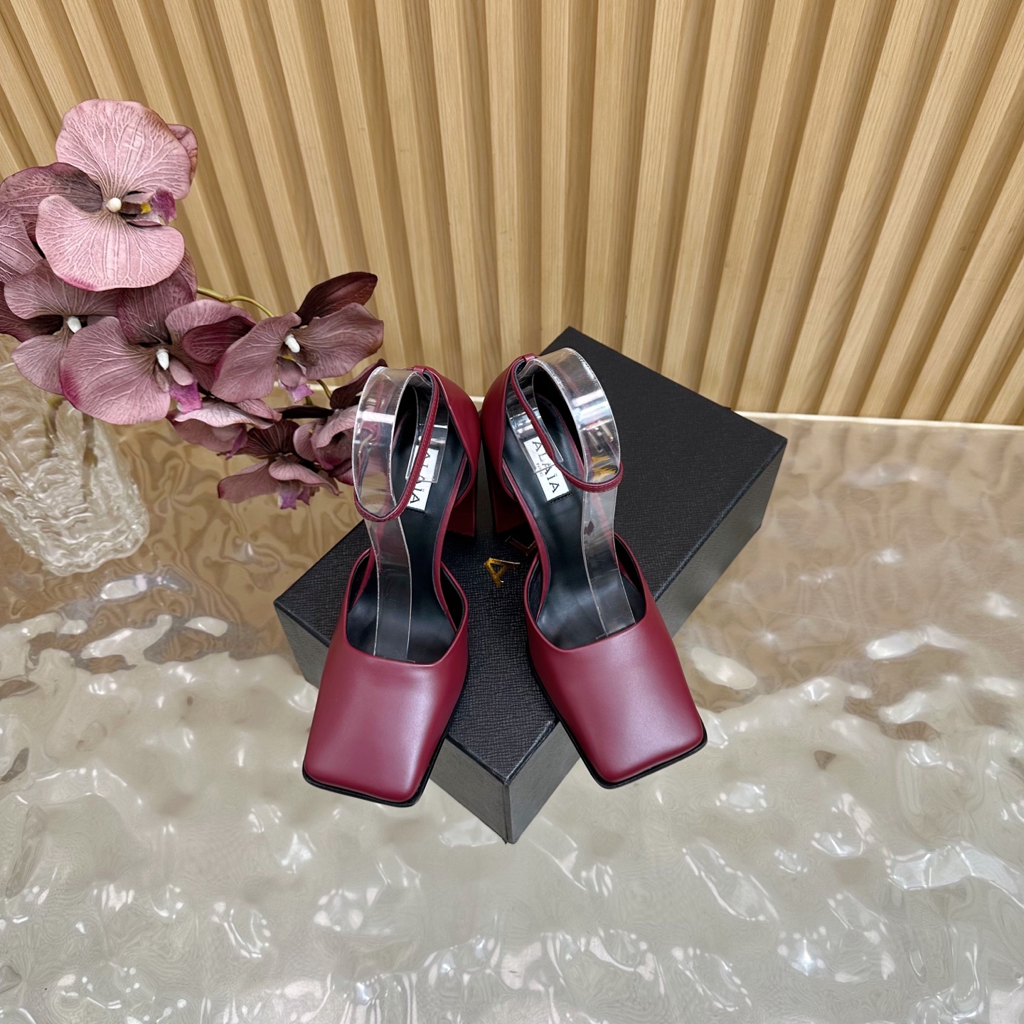 ALAÏA Minimalist Leather Ankle-Strap Block-Heel Pumps