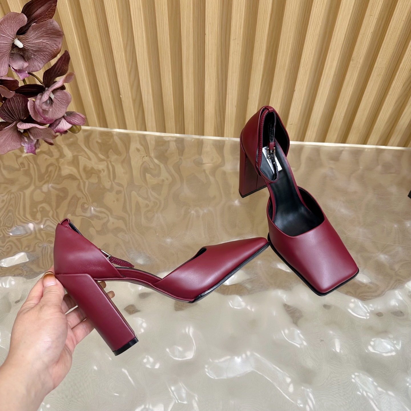 ALAÏA Minimalist Leather Ankle-Strap Block-Heel Pumps