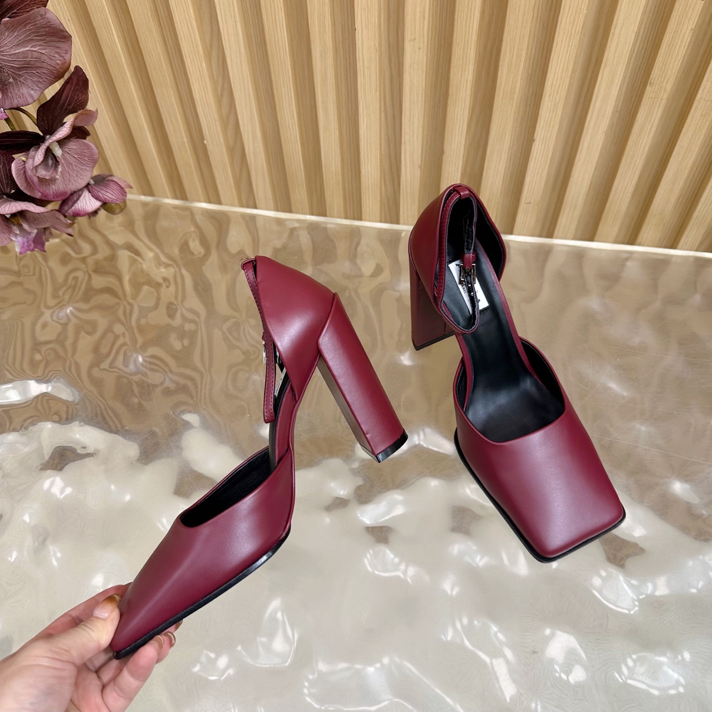 ALAÏA Minimalist Leather Ankle-Strap Block-Heel Pumps