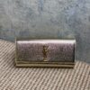 SAINT LAURENT Cassandre Metallic Logo Clutch Bag 1
